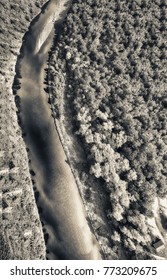 Overhead View Of River Crossing Beautiful Forest.