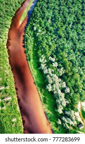 Overhead View Of River Crossing Beautiful Forest.