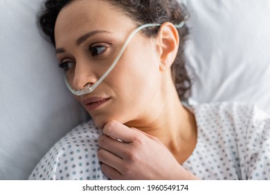 Overhead View Of Sick African American Woman Lying In Hospital Bed With Nasal Cannula