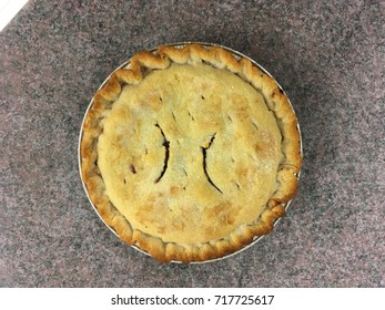 Overhead View Of A Single Peach Pie On A Counter.