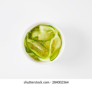 Overhead View Of Sliced Cucumbers And Sprinkled With Spice