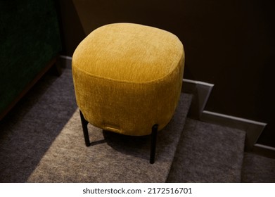 Overhead View Of A Stylish Velour Yellow Footstool, Ottoman In The Furniture Design Showroom