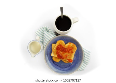 Overhead View Of A Table Setting Of Peanut Butter And Jam On White Toast Isolated On White