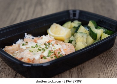 Overhead View Of Take Out Order Of Shrimp With Jasmin Rice And Chopped Vegetables Is Conveniently Packed In A Microwavable Container.