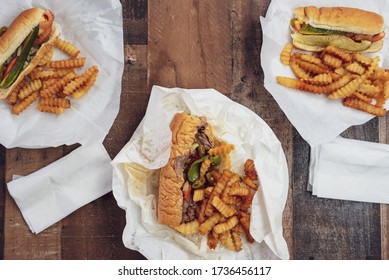 Overhead View Of Takeout Food On A Wood Table - Supporting Local Restaurants