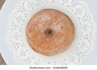 Overhead View Of Tempting Fresh From The Oven Sugar Glazed Donut From The Bakery Served On A Plate.