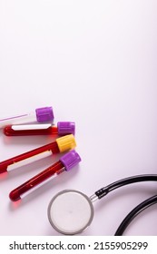 Overhead View Of Test Tubes With Blood Samples And Stethoscope On White Background, Copy Space. Blood, Test Tube, Medical, Test, Sample, Laboratory And Healthcare Concept.