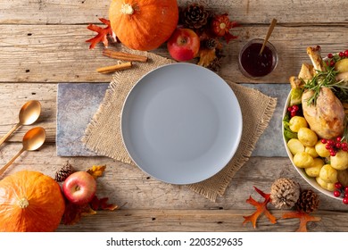Overhead View Of Thanksgiving Table With Plate, Roast Turkey, Potatoes And Autumn Decoration. Thanksgiving, Autumn, Fall, American Tradition And Celebration Concept.