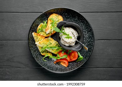 Overhead View Of Toasted Garlic Bread, Tomato And Chicken Pate On A Plate