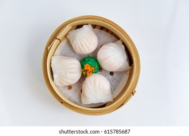 Overhead view of tradition Chinese prawn dumplings placed in a bamboo steamer - Shutterstock ID 615785687