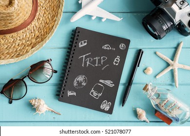 Overhead View Of Traveler's Accessories And Items With Copy Space On Wooden Background, Travel Concept