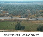 Overhead view of a truck on a highway in Iraq, during Operating Iraqi Freedom