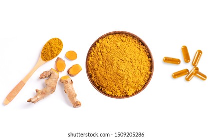 Overhead View, Turmeric Powder( Curcuma Longa Linn) In Wooden Bowl With Root Sliced And Capsules Isolated On White Background.