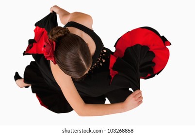 Overhead View Of Turning Dancer Against A White Background