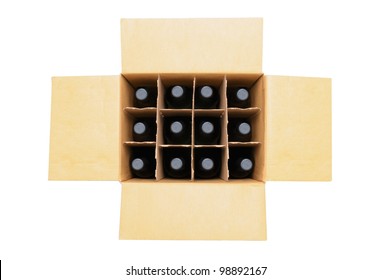 Overhead View Of A Twelve Bottle Case Of Red Wine Over A White Background. Box Is Open With The Flaps Extended.