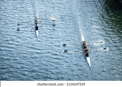 Overhead View Of Two Four-person Crew Teams Racing Rowing Shells