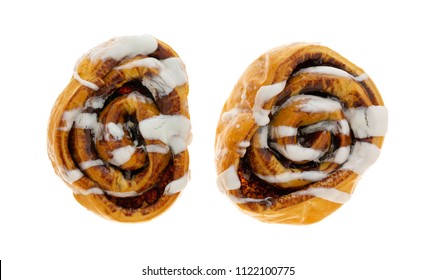 Overhead View Of  Two Freshly Baked Cinnamon Rolls Isolated On A White Background.