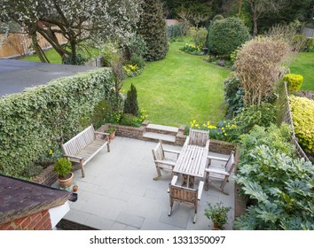 Overhead View Of A Typical Suburban Garden With Patio Furniture In Pinner, London, UK