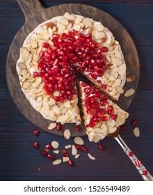 Overhead View Of A Vegetarian Spaghetti Squash Cake Topped With Pomegranate Seed And Slivered Almonds