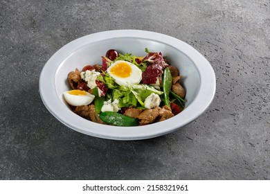 Overhead View Of Warm Salad With Roast Beef And Boiled Egg On Top