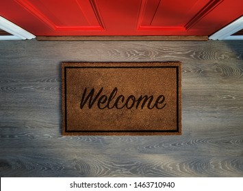 Overhead view of welcome mat outside inviting front door of house - Shutterstock ID 1463710940
