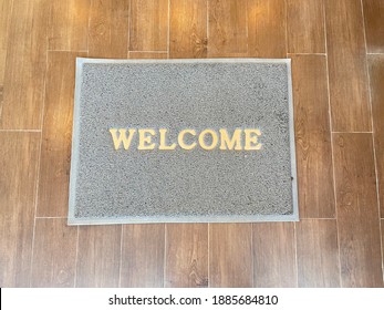 Overhead View Of Welcome Mat Outside Inviting Front Door Of House