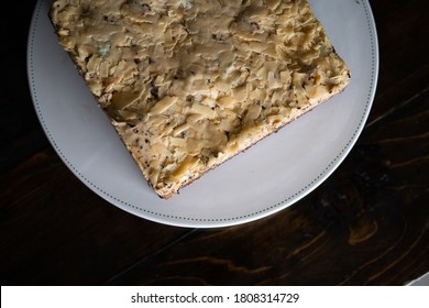 Overhead View Of  White  Chocolate Cake On A White Plate.