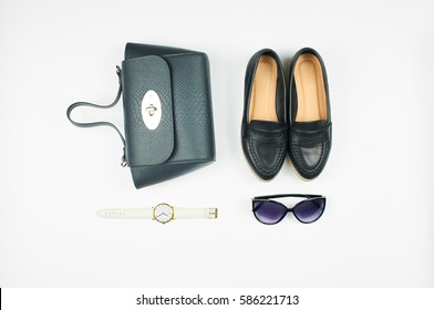 Overhead View Of Women's Fashion Set Of Accessories Isolated On White Background. Top View Of Leather Bag, Shoes, Sunglasses And Watch