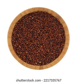 Overhead View Of A Wood Bowl Filled With Red Quinoa On A White Background.