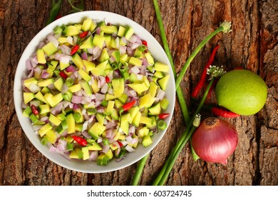 Overhead  View-Homemade Raw Mango Salsa On A Wooden Background.