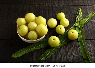 Overhead view-Indian Amla or gooseberry on rustic wooden background,