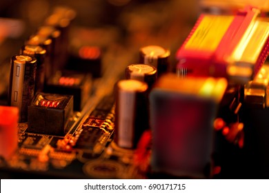  Overheated Transistor On Computer Board In Red And Gold Coolors