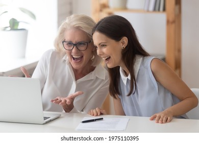 Overjoyed diverse female colleagues look at laptop screen shocked by unexpected good notice or news online. Excited women employees celebrate business win work together on computer. Success concept. - Powered by Shutterstock