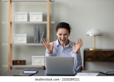Overjoyed euphoric mature old woman looking at computer screen, celebrating business achievement, online lottery win, internet success, getting notification with job offer or making profitable deal. - Shutterstock ID 2103289211