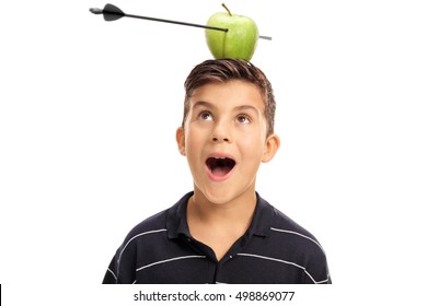 Overjoyed little boy looking at an apple pierced by an arrow on his head isolated on white background