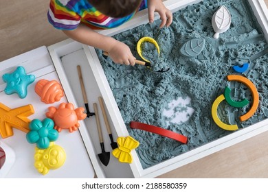 Overjoyed Male Kid Playing Kinetic Sand With Mother Babysitter Teacher Early Development Education Game Fine Motor Skills. Excited Baby Boy Holding Sandy Shape Enjoy Happy Childhood Education Play