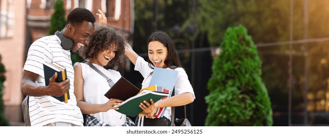 Overjoyed Multicultural Students Checking Exam Results And Celebrating Success, Standing Over University Background, Panorama