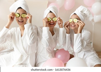 Overjoyed Multiethnic Millennial Girls Wearing Bathrobes Have Fun Make Beauty Procedures Enjoy Bachelorette Bridal Shower At Spa Or Hotel, Happy Multiracial Female Friends Celebrate Hen Party