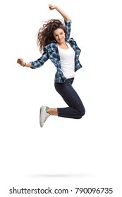 Overjoyed teen girl jumping and gesturing happiness isolated on white background