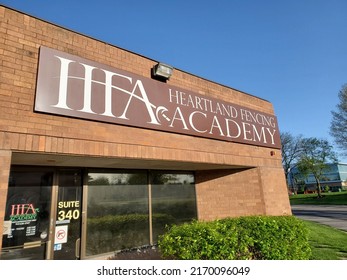 Overland Park, Kansas, USA - April 30, 2022: Sign Above Building Entrance For HEARTLAND FENCING ACADEMY On Sunny Day