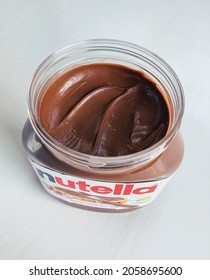 Overland Park, KS  USA - October 15, 2021: An Open Jar Of Nutella With A Plain White Background