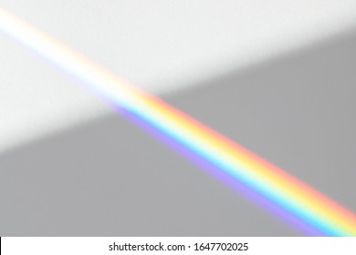 Overlay effect for photo   mockups  Organic drop diagonal shadow   ray light and rainbow from window white wall 