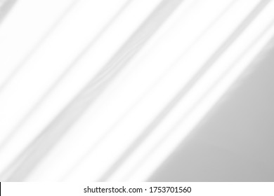 Overlay effect for photo and mockups. Organic drop diagonal shadow and rays of light from window on a white wall. shadows for natural light effects