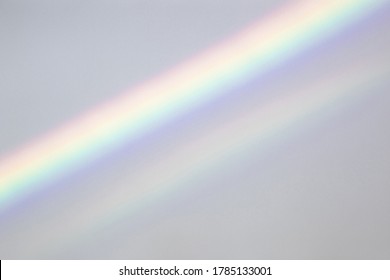 Overlay Effect For Photo And Mockups. Organic Drop Diagonal Shadow And Ray Of Light With Rainbow From Window On A White Wall.