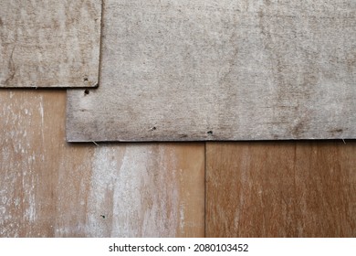 Overlaying Weathered Old Chipboard Construction Fence Wood Panels 