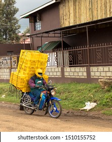 Overloaded scooter on a village's road, Mombasa Kenya