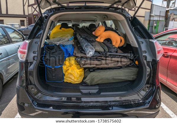 Overloaded trunk\
of fisherman car before go\
fishing