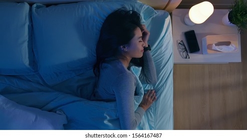 Overlooking Of Asian Woman Sleep Well With Smile At Night 