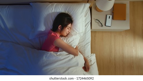 Overlooking Of Asian Woman Sleep Well With Smile At Night 