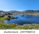 Overlooking the blue lake in Qaqortoq, Greenland. Landscape.